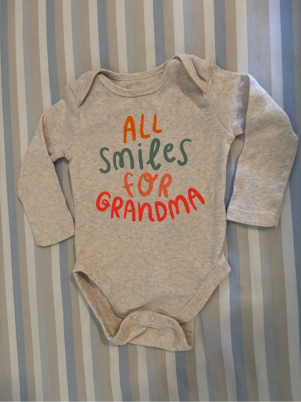 All Smiles for Grandma Beige Long-Sleeve Baby Onesie
